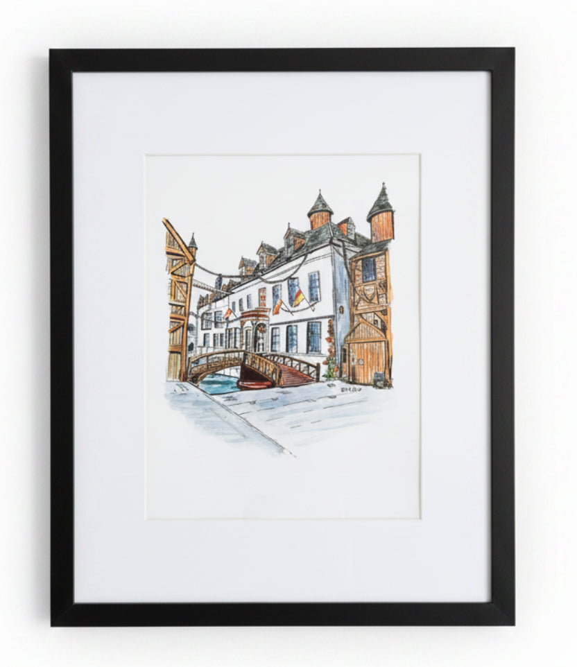 A framed watercolor painting of the Owain Glyndwr Hotel in Corwen, reimagined in a fantasy style