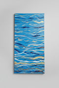 Painting of wavy blue and white patterns on canvas