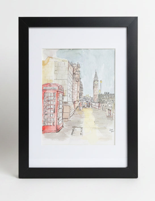A framed watercolor painting of a London street scene, featuring a red telephone booth and Big Ben